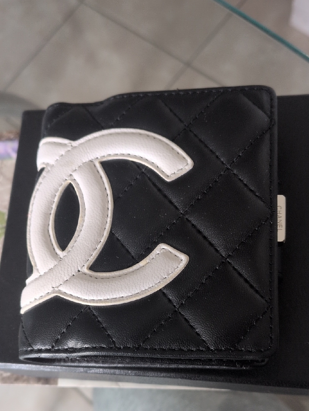 CHANEL Cambon Ligne compact wallet in black quilted leather wit